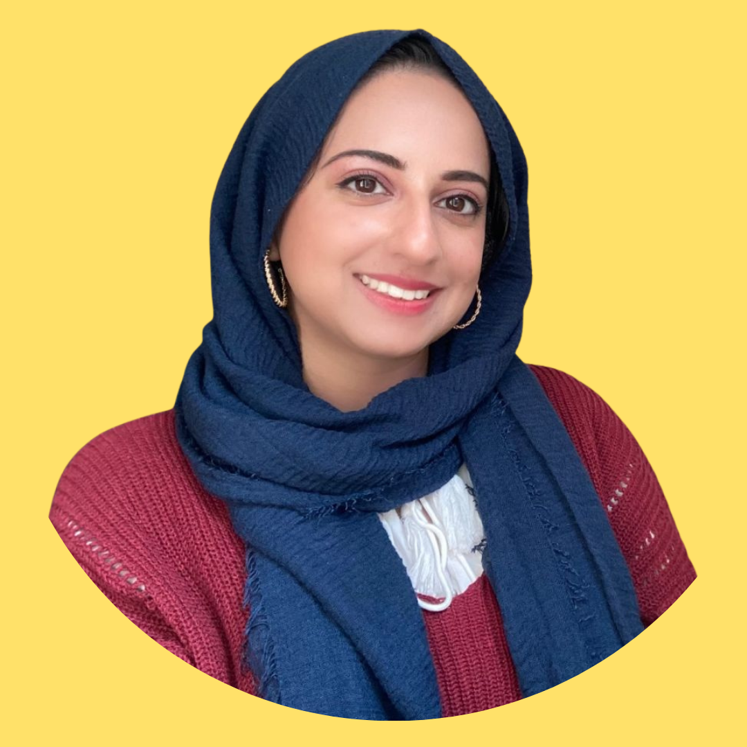 Image of Tooba the founder of Thrive Social Work - a smiling young woman with light brown skin wearing a dark blue hijab.